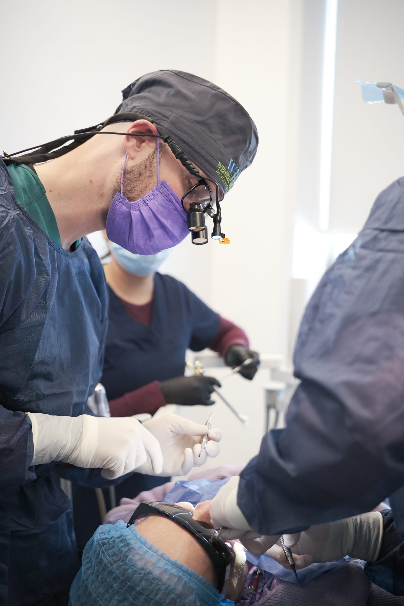 Dr. Harris placing a dental implant at Nordic Family Dental